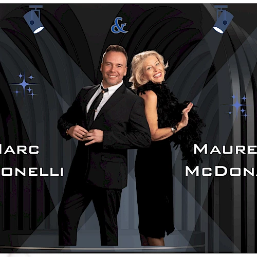 Two people in formal attire pose on a stage under spotlights, with names “Marc Antonelli” and “Maureen McDonald” displayed; a decorative backdrop.